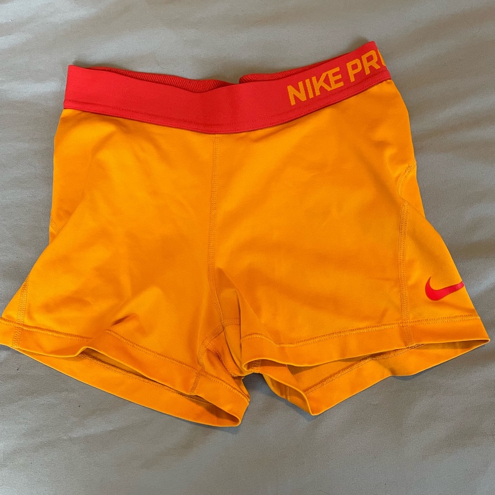Orange Nike pro shorts